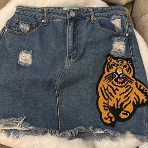 Judith March denim skirt with tiger patch